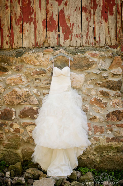 Bridget's wedding dress hangs on the Barn in Auburndale, WI