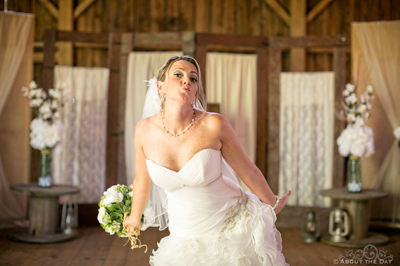 Playful Bride makes faces in the Barn at Youngs Dairy Farm