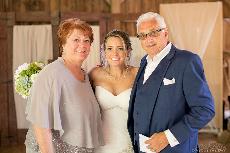 Bride and her parents in the Barn at Youngs Dairy Farm