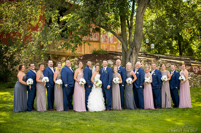The full wedding party in from of the Barn at Youngs Dairy Farm