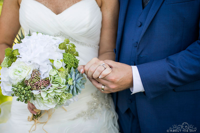 Bride and Groom rings and flowers in Auburndale, WI