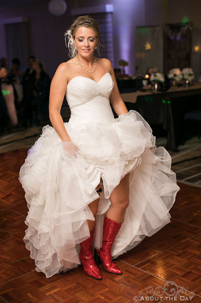 Bridget shows wedding dress with red sparkle boots