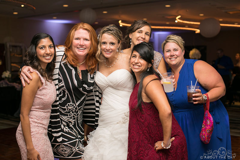 Bride poses with girls during reception dances at Hotel Marshfield