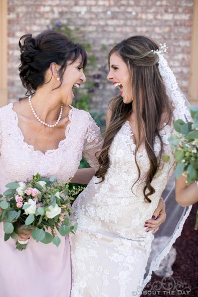 Bride and her mother laughing