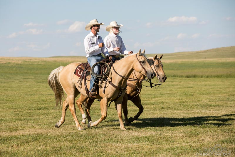 Cowboys ride horses to start wedding ceremony at Haythorn Land & Cattle Co