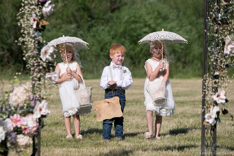 Flower girls and ring boy enter wedding ceremony