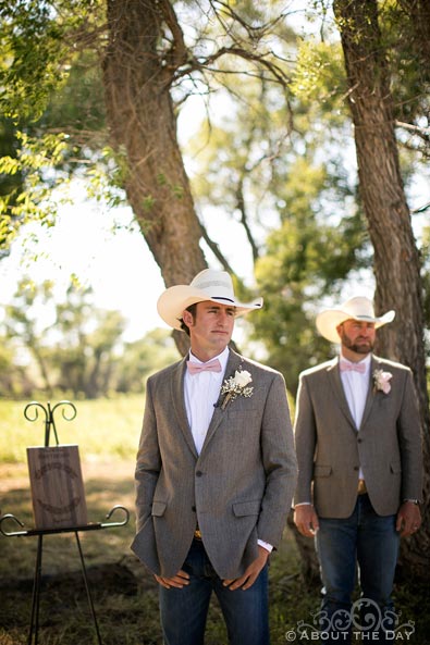 Cowboy Groom looks on as Bride comes down the isle at Haythorn Land & Cattle Co