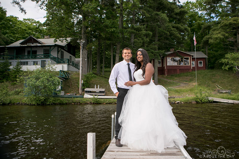 Wedding couple stand on the dock with Keith Island as background