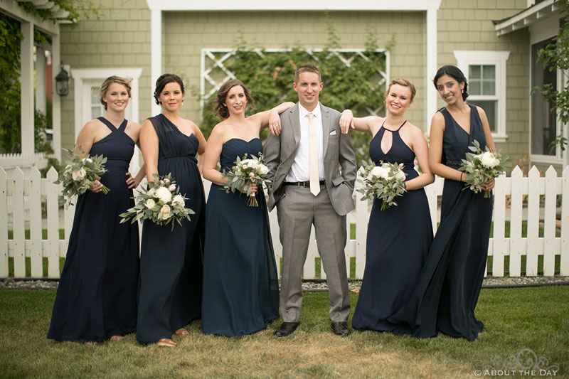 Groom hams it up with the Bridesmaids