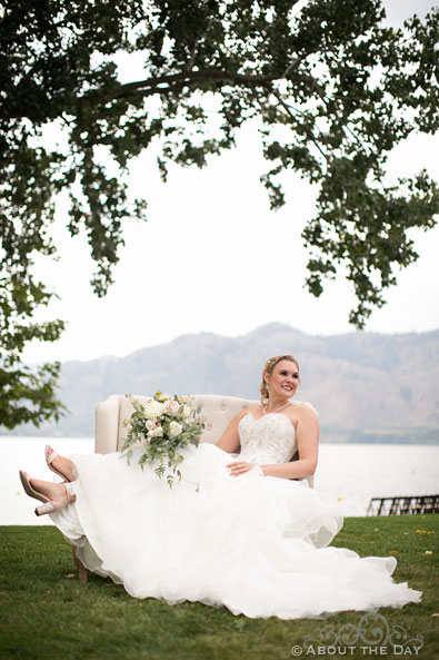 Gorgeous Bride relaxes on a outside couch at Veranda Beach Resort in Oroville, Washington