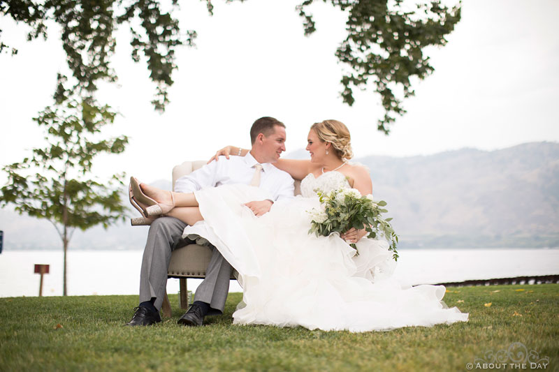 Chris and Paige relax on a outside couch at Veranda Beach Resort in Oroville, Washington