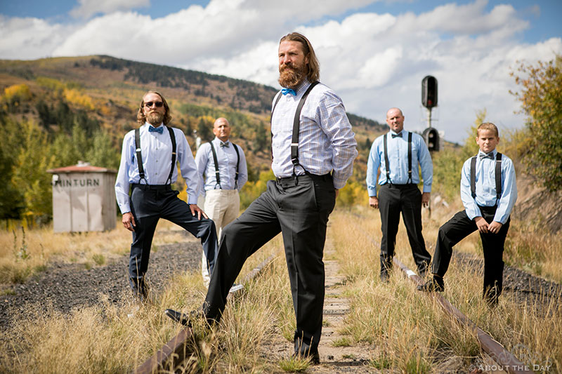 Justin and the Groomsmen stand on Minturn Railroad tracks