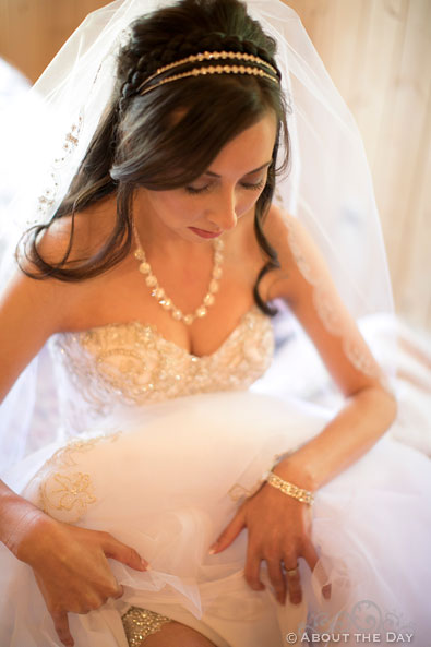 Lovely Bride adjusts her dress