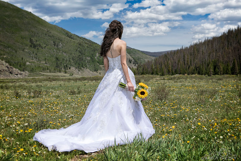 The Bride shows her dress in Platoro, CO