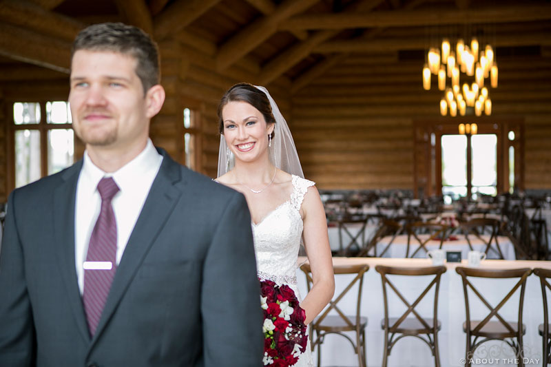 Bride comes up behind Groom during first look