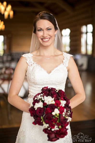 A beautiful Bride with red roses at the Evergreen Aviation & Space Museum