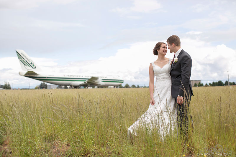 Bride and Groom pose in front of 747 at the Evergreen Aviation & Space Museum