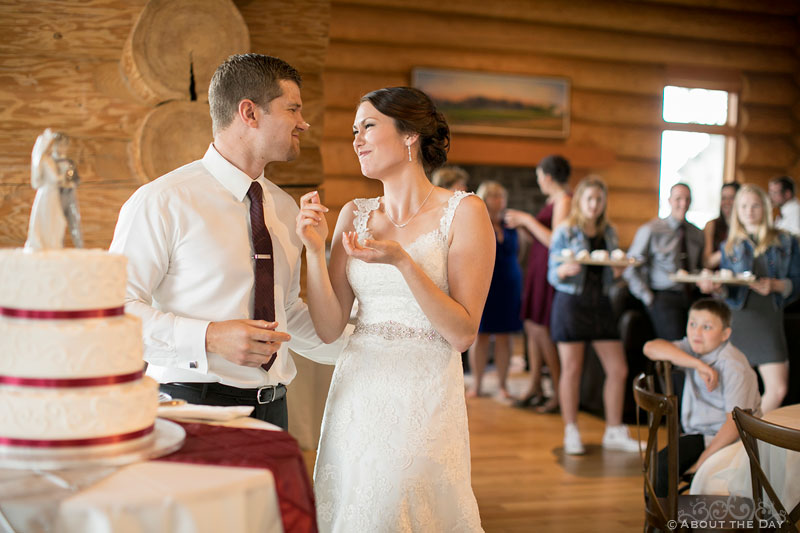 Bride and Groom have a little cake fight during cake cutting