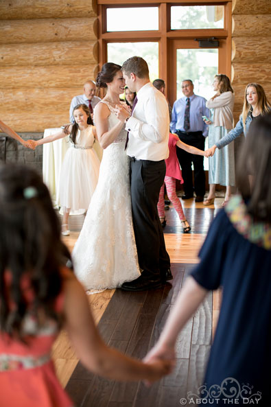 Bride and Groom are surrounded during their dance