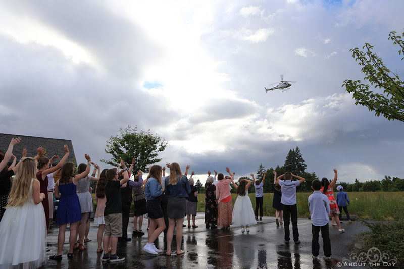Brides and Groom do a fly-by over wedding guests