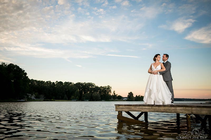 Keith and Erica stand on the dock of Lake Oconee at sundown