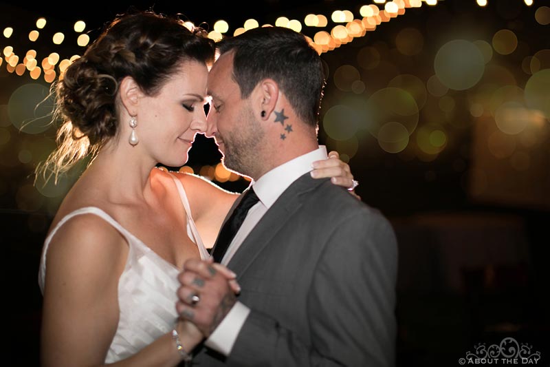 Bride and Groom under glowing lights during last dance