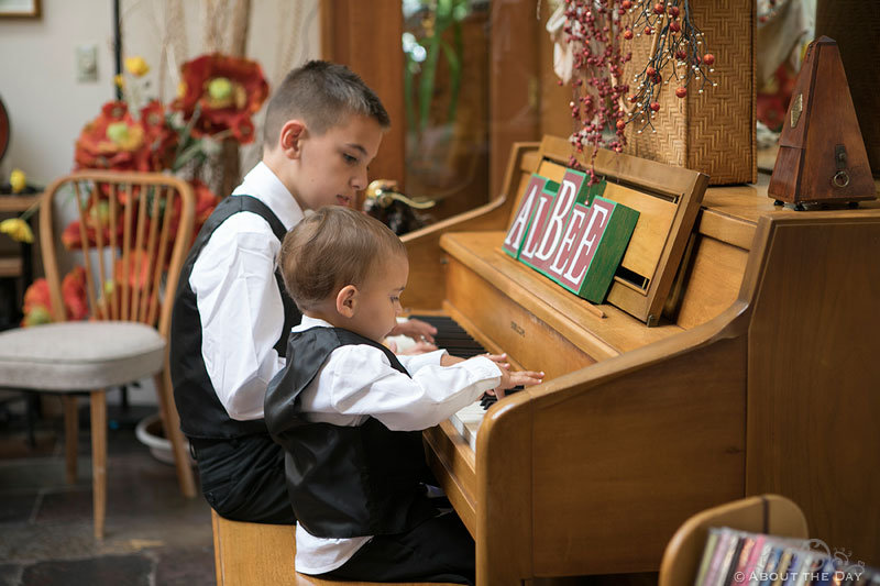 Young boys play on the piano at Albees Garden in Olympia