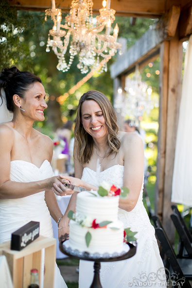 Gay Brides cut wedding cake