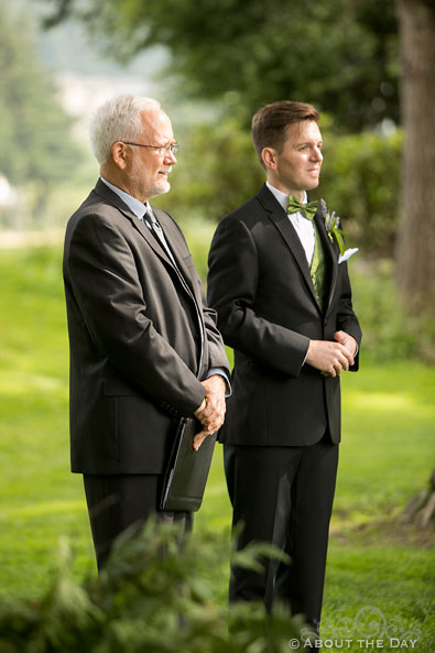 Groom looks at Bride coming down the isle on Thunder Island in Cascade Locks