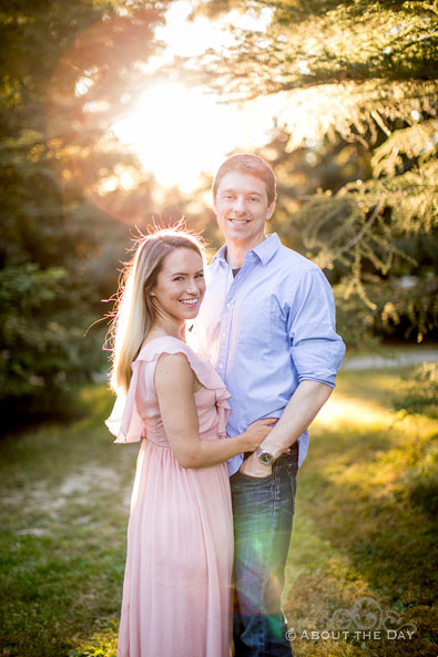 Alex & Andrew smile in the golden sunset at Seattle arboretum