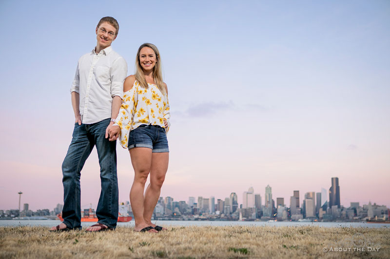 Andrew and Alex loom over the Seattle Skyline during sunset at Alki Beach