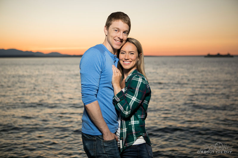 Andrew and Alex pose together with a beautiful sunset at Alki Beach