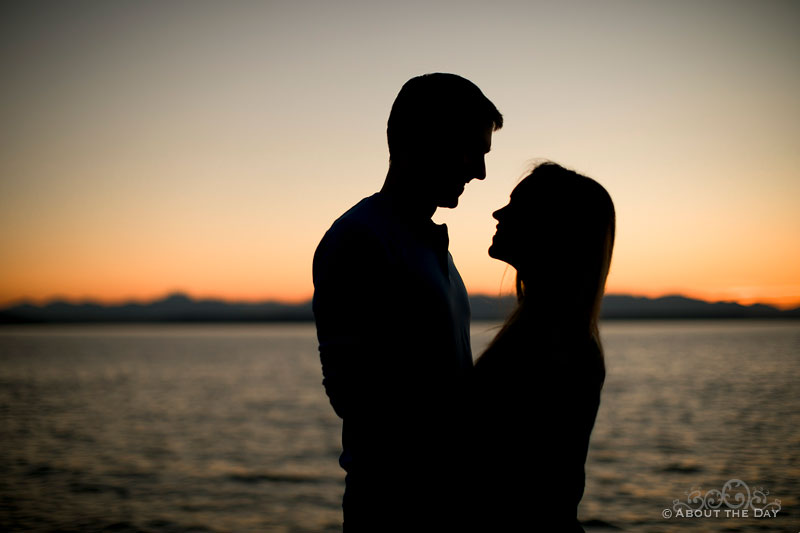 Silhouette of Andrew and Alex during a dramatic sunset at Alki Beach
