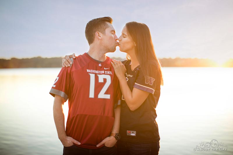 Kissing couple with Courgars and Huskies jerseys