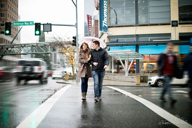 Will & Madelyn cross a rainy street in Bellevue, WA