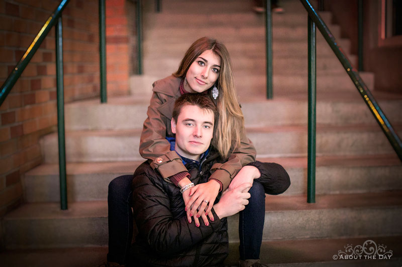 Will & Madelyn sit on the stairs inside Bellevue Square