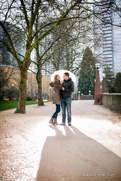 Will & Madelyn hold back the rain with their umbrella