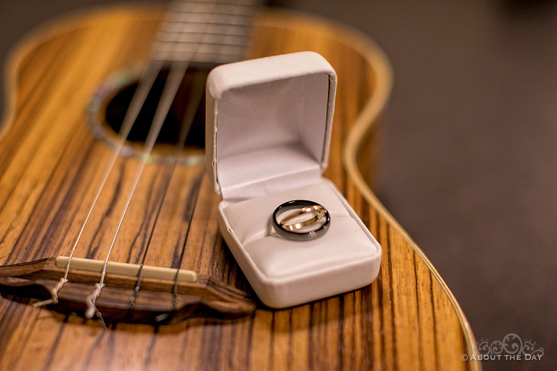 Wedding rings on wooden guitar