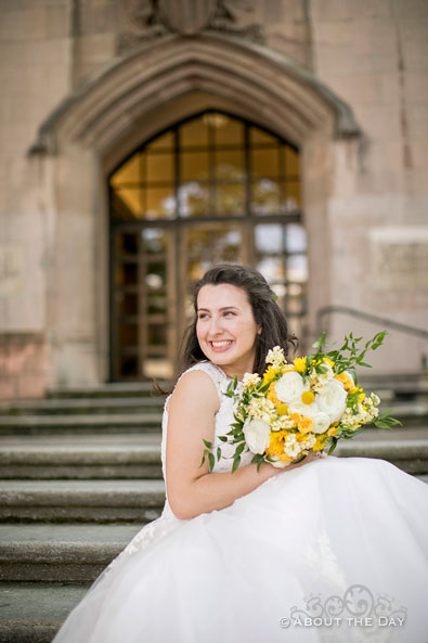 The Bride looks amazing sitting on the steps of Gerberding Hall