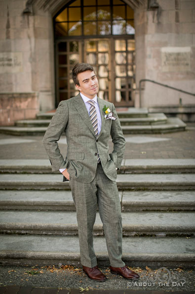 The Groom standing on the steps of Gerberding Hall look so cool