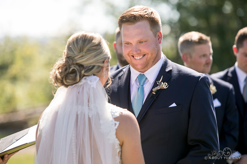 Austin smiles at Karleigh while she says her vows