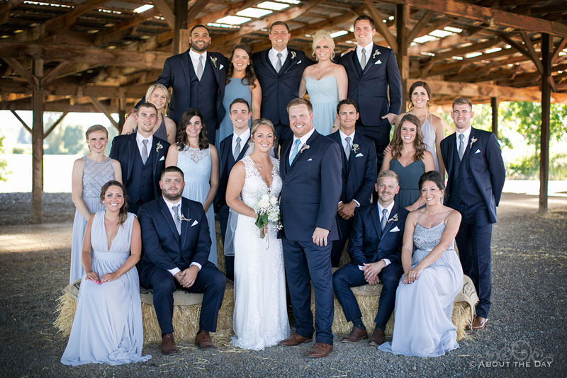 The wedding party standing on bails of hay at Heiser Farms