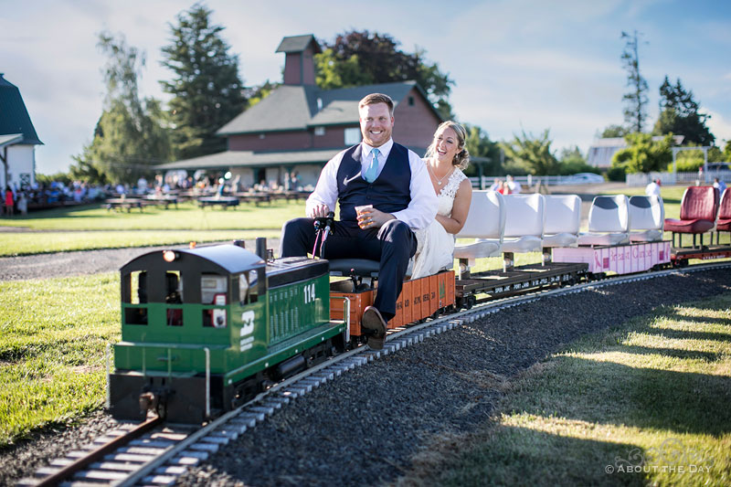 The Bride and Groom take a minature train ride at Heiser Farms
