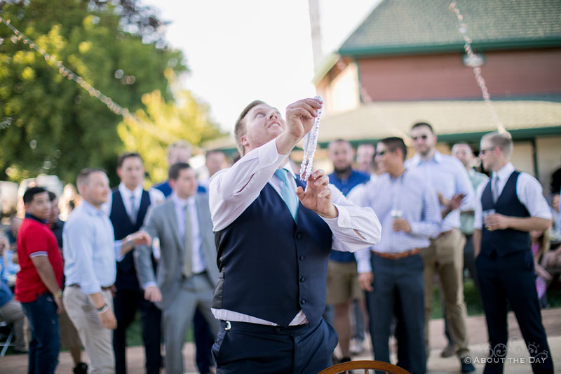 Austin gets ready to toss the wedding garter to the single guys