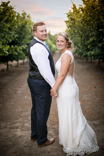 The Bride and Groom in the orchards at Heiser Farms