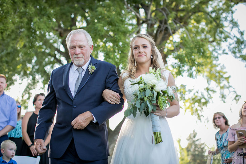 Courtney and her father come down the isle