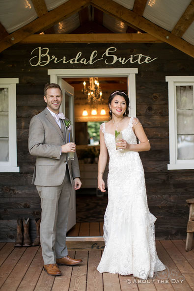 Eric and Ami have a drink outside the Bridal Suite at The Orchard at Sunshine Hill