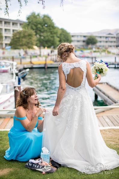 Final adjustments to the Brides dress at Campbell's Resort at Lake Chelan