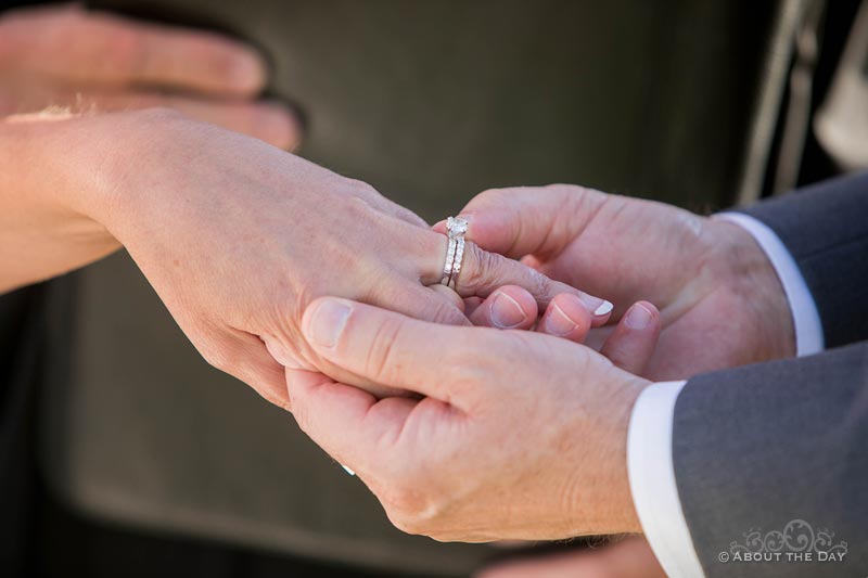 Bride and Groom exchange rings at Campbell's Resort at Lake Chelan