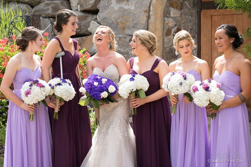 Alexis and her wedding party laughing at Karma Vineyards
